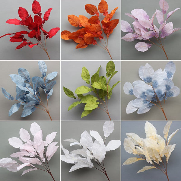 Wedding props party decoration  artificial flowers. 4 forks. grapefruit leaves. haze. blue-red wedding decoration background. floral arrangement. road introduction. flower arrangement. landscaping